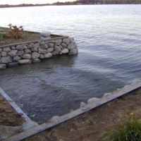 Side view of inlet that we changed look with nice stones in Sylvan Lake, MI