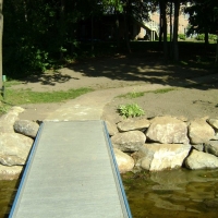 Repaired wall supporting the Dock along shore of Brighton Lake