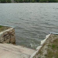 Stairs into Galvanized steel seawall