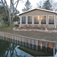 2014 repair of another contractor's inproperly installed wall along canal in Pinckney, MI