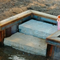 Stone Steps incorporated into steel wall in Fenton