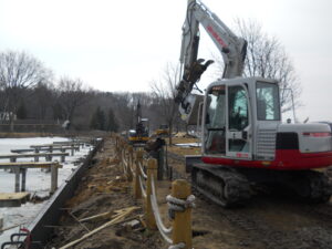 Seaside seawalls installing a steel seawall in waterford michigan on cass lake