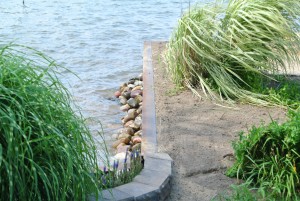 Seawall finished and sanded, soiled and seeded for an attractive, finished look